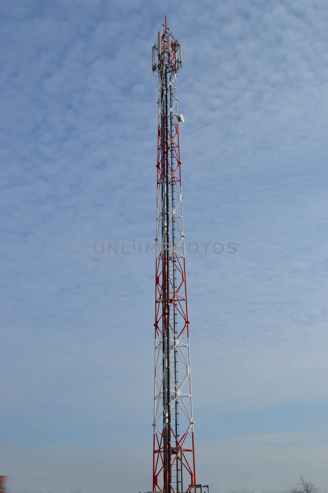 Antenna tower for mobile phone with blue sky background