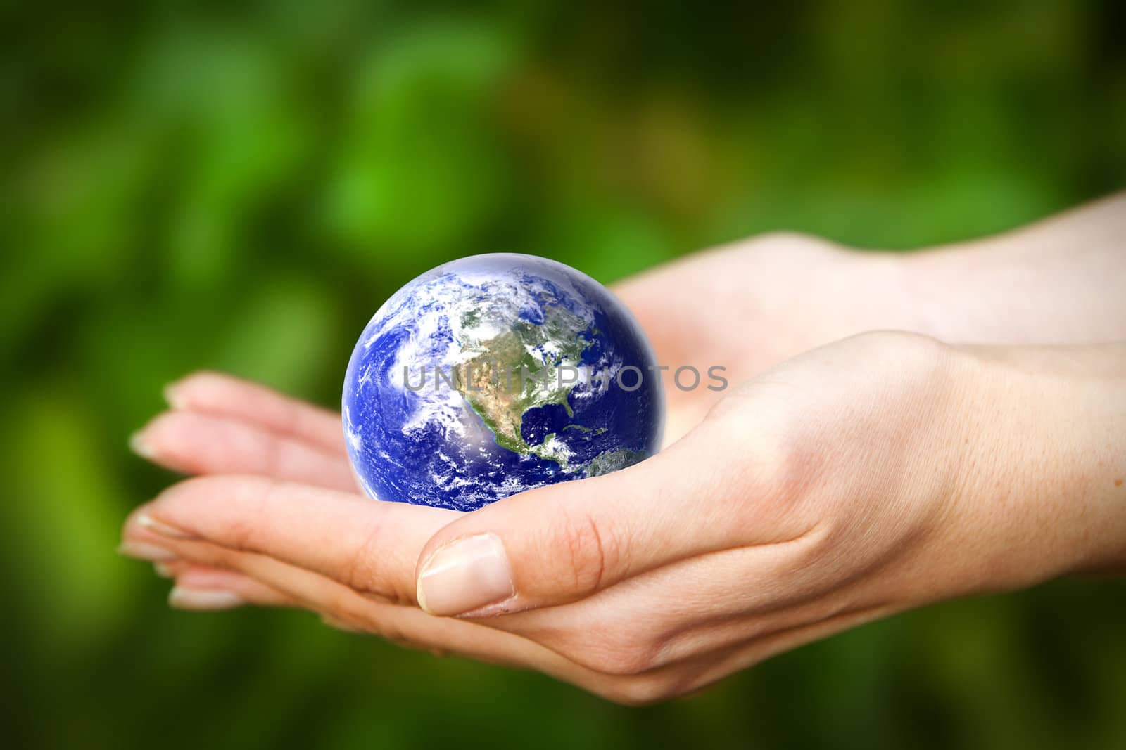 human hands carefully holding Earth planet. Glass World