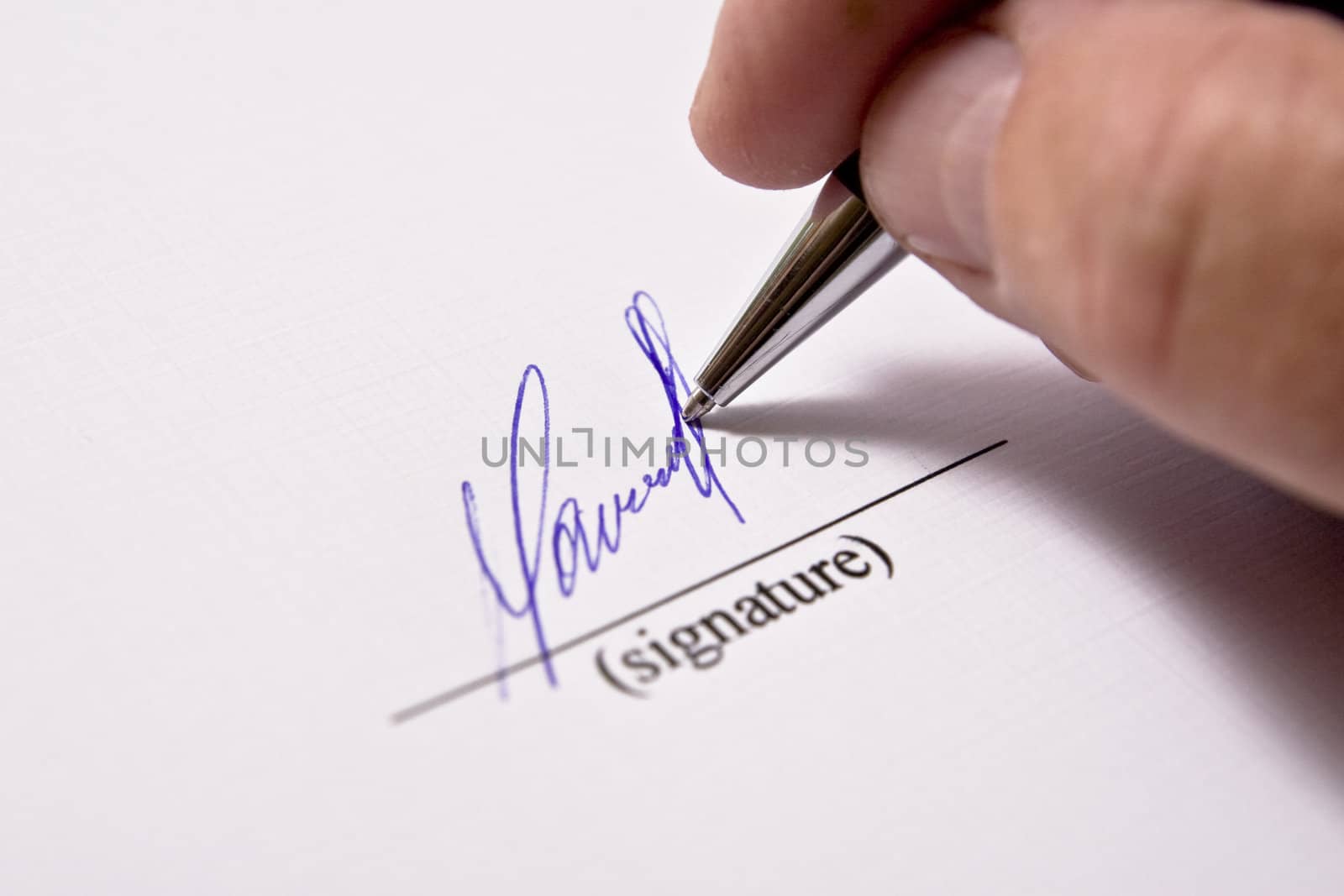 Man signing papers. The signature.