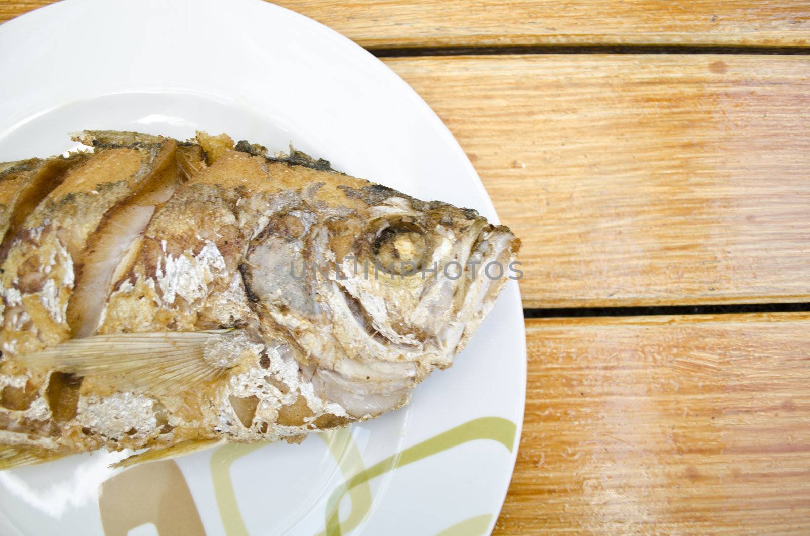 Fried fish on dish, delicious thai food