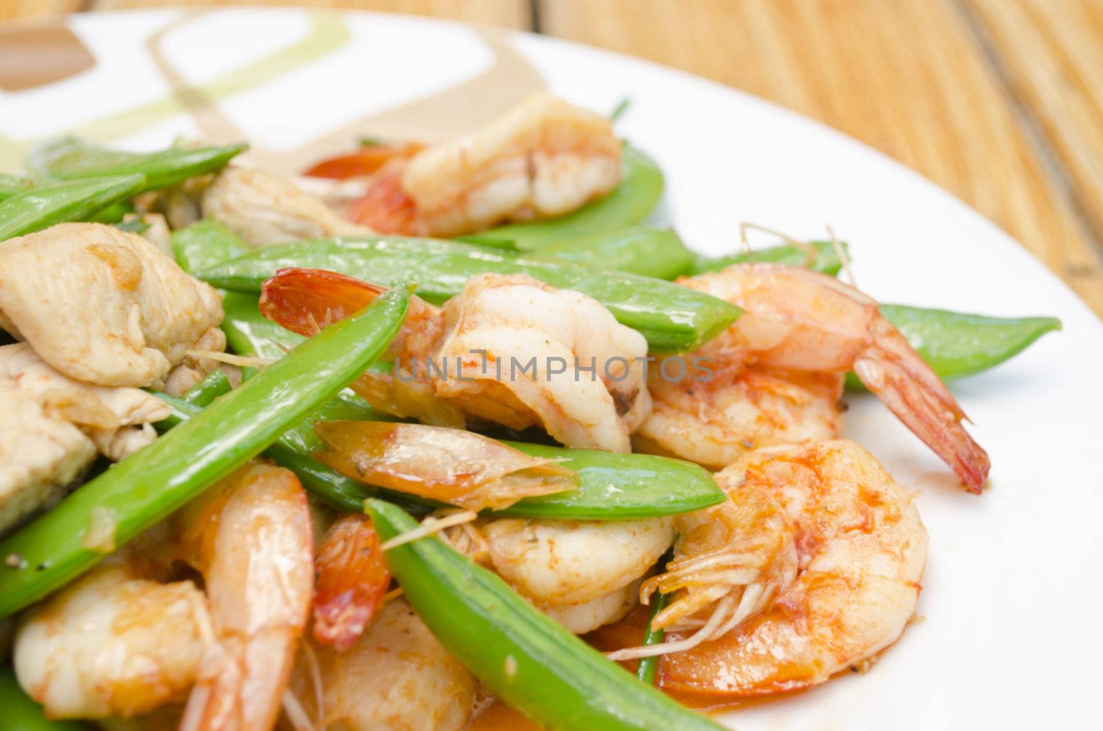 Close-up of Fried shrimp, pork and sweet peas. delicious thai food