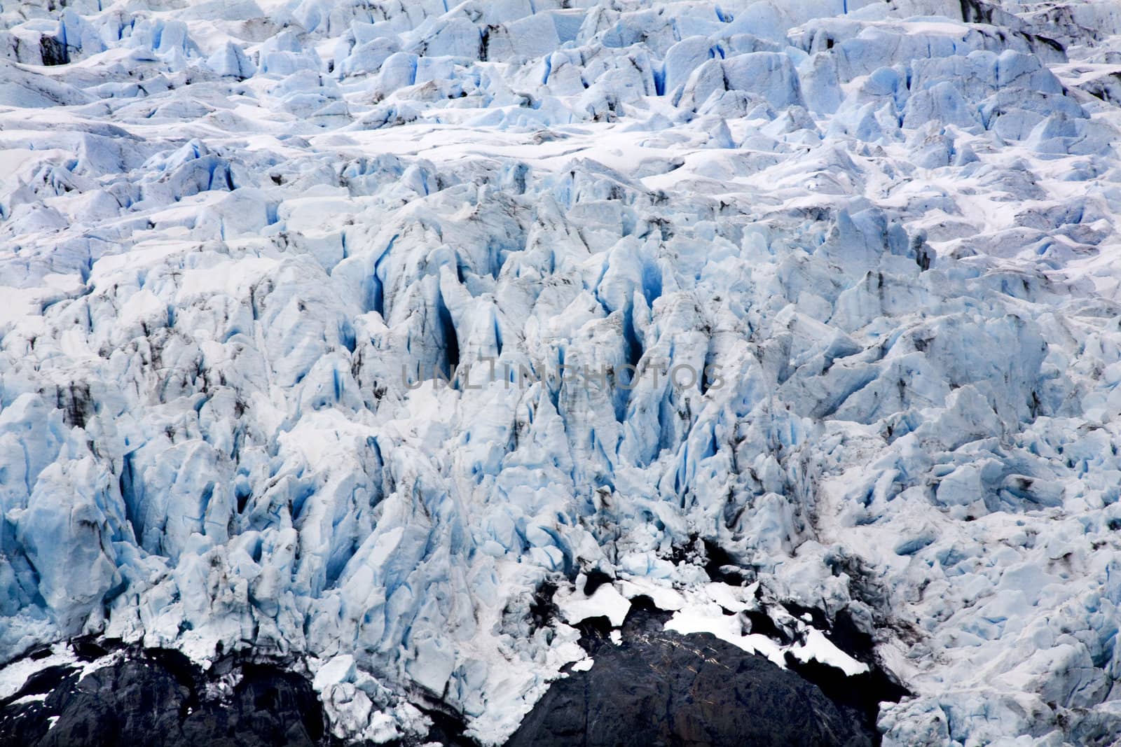 Blue Icy Portage Glacier with Black Rock Anchorage, Alaska

