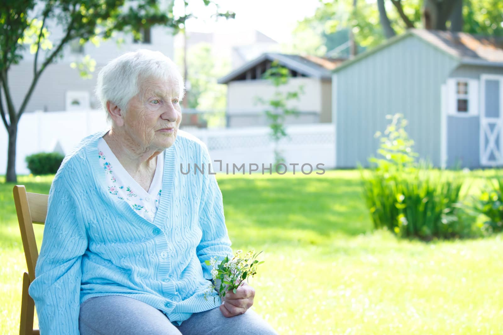 Senior lady relaxing outside in spring day