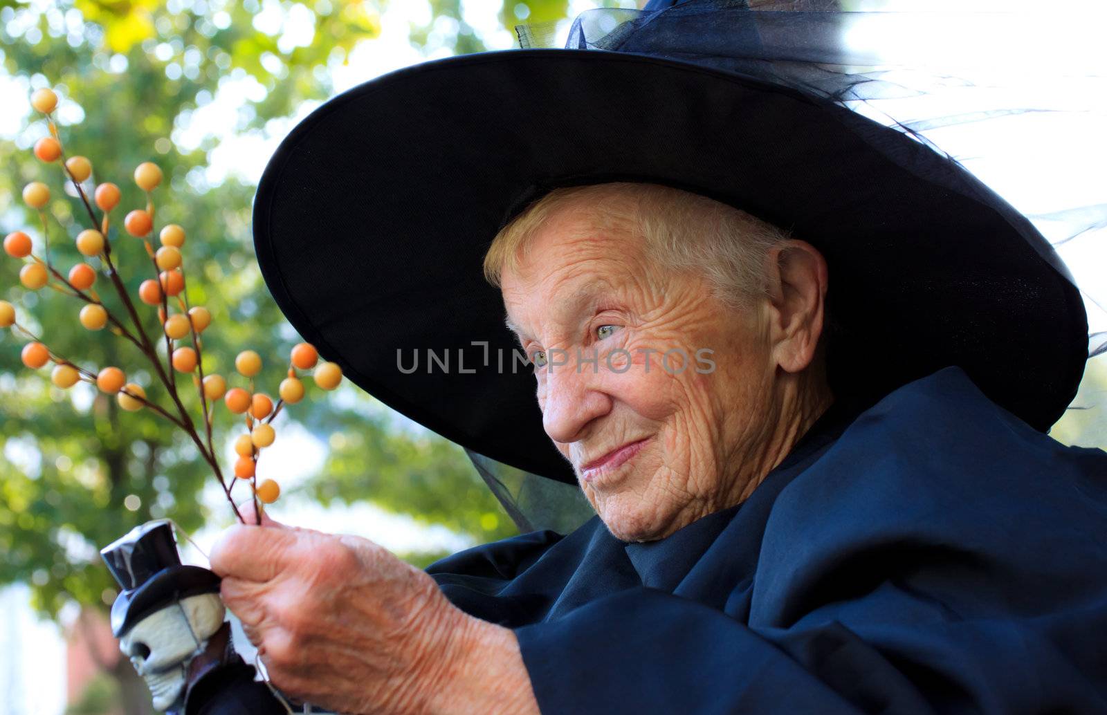Senior lady in witch costume by melpomene