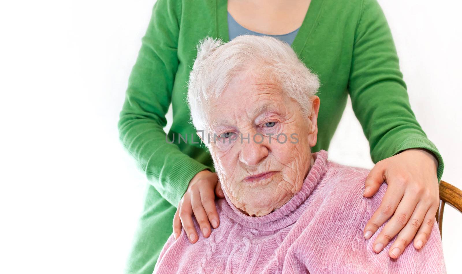 Senior and young woman together on white background