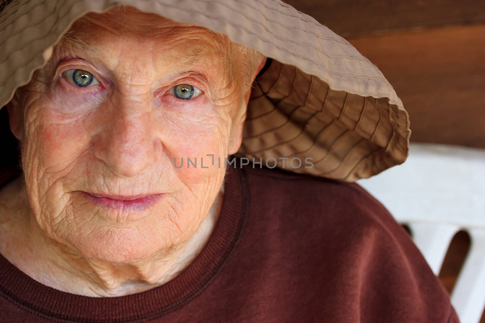 Portrait of senior woman in brown hat