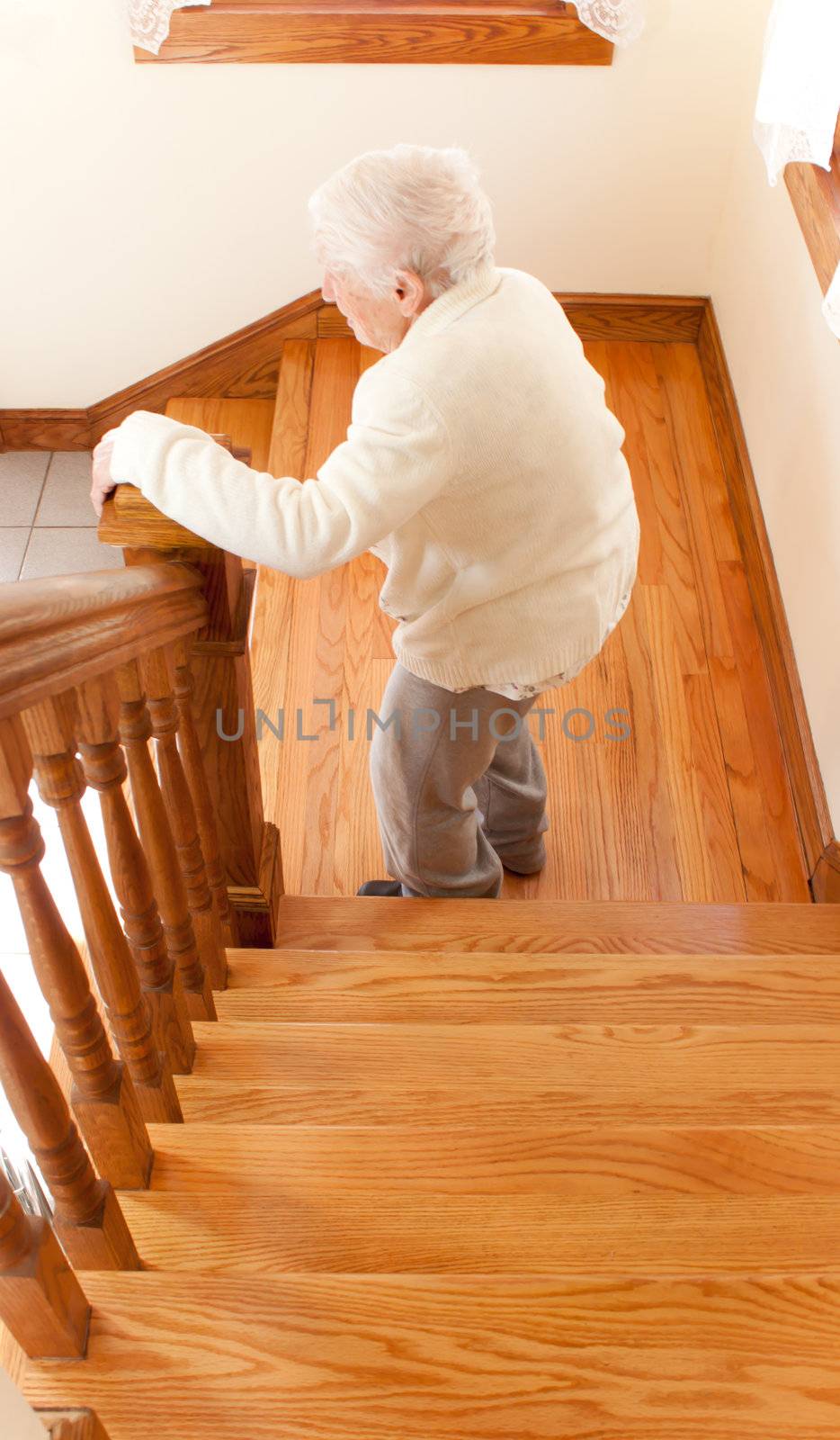 Senior Woman in front of Staircase by melpomene