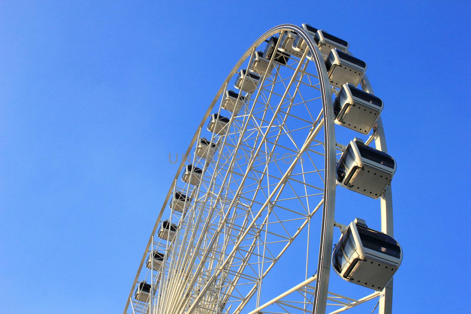 Ferris wheel with clear blue sky