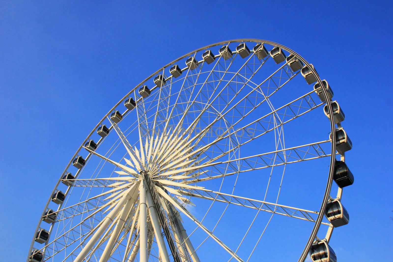 Ferris wheel with clear blue sky by nuchylee