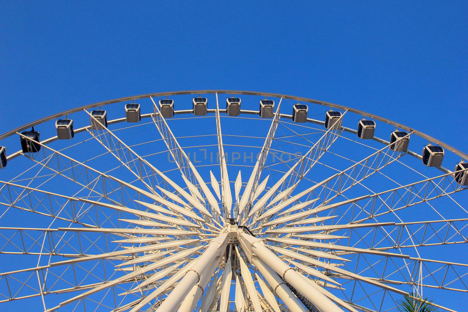 Ferris wheel with clear blue sky by nuchylee