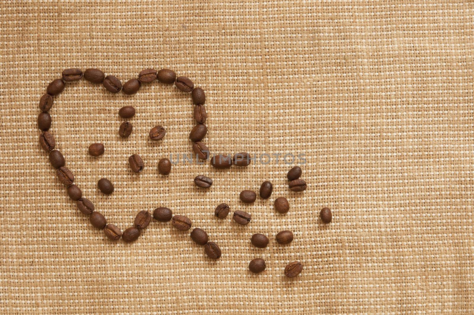 love symbol made of coffee beans ruptured