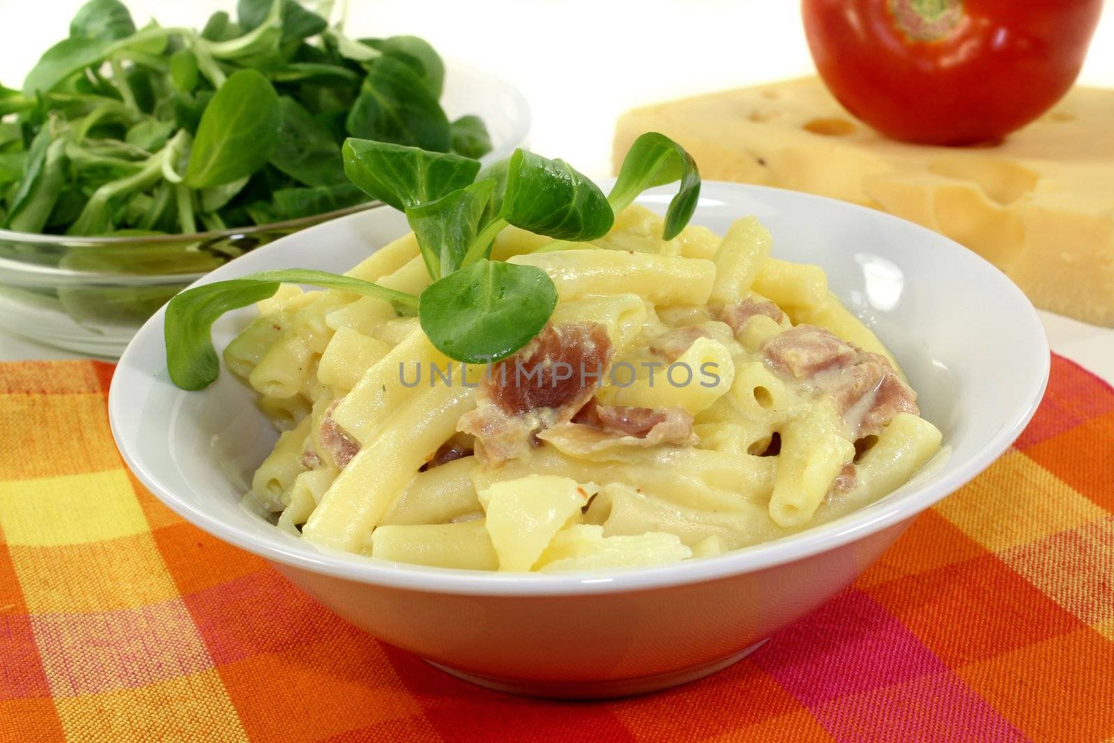 Pasta Carbonara with ham and corn salad