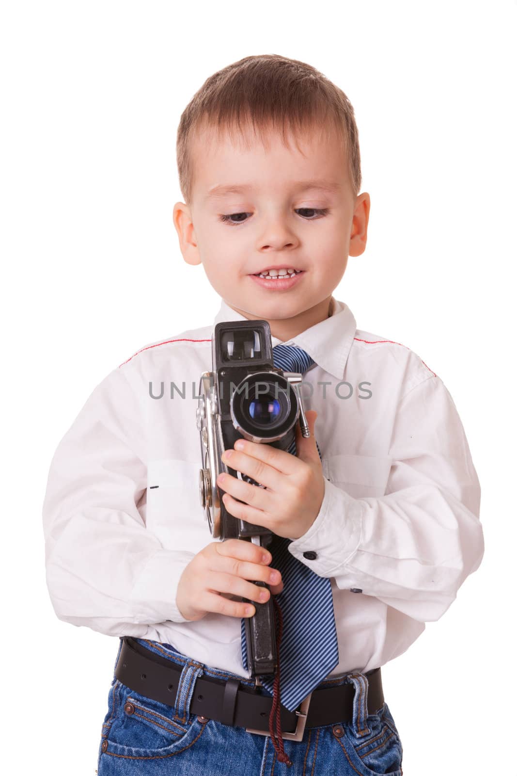 Clever small boy with vintage video camera isolated on white background