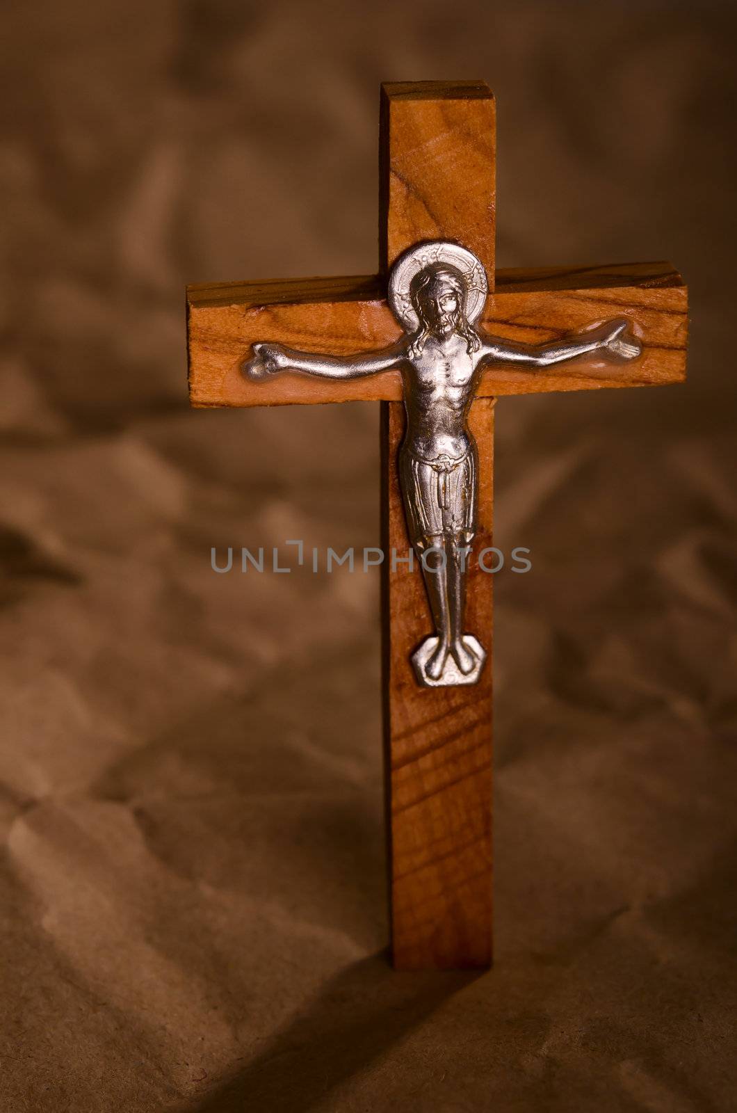 Crucified wooden cross with Jesus Christ vintage background