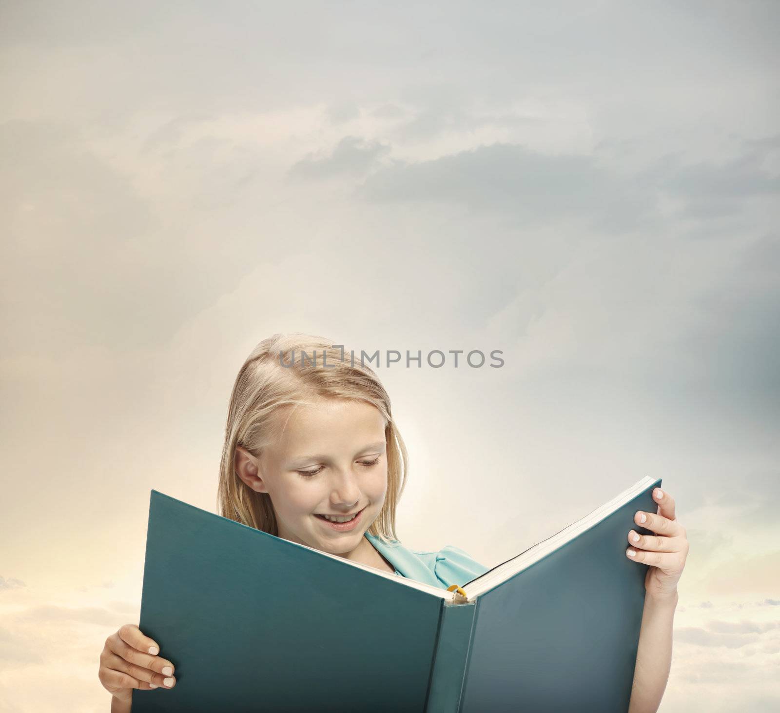 Little Blonde Girl Reading a Big Blue Book