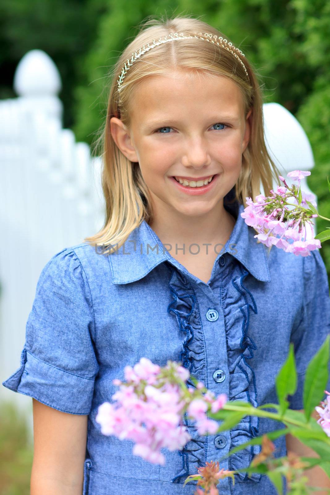 Young Blonde Girl Smiling Outside
