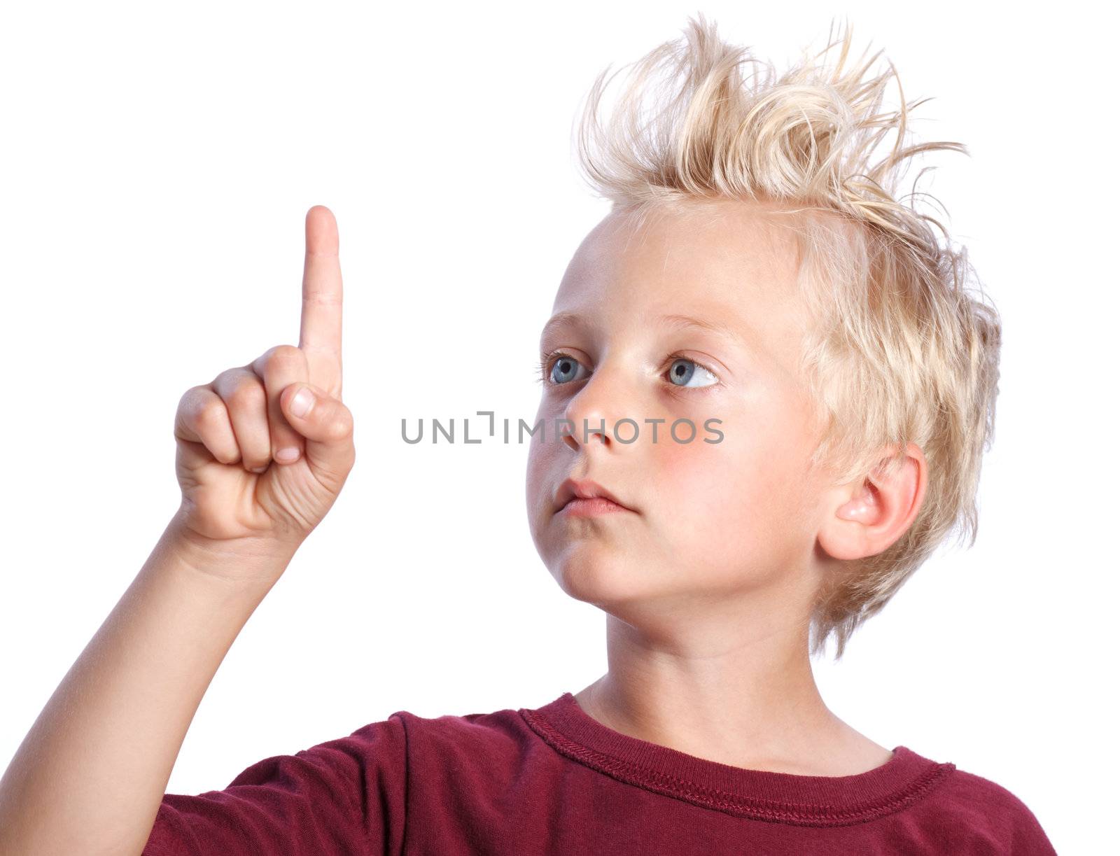 Young Blonde Boy Looking and Pointing at Your Product or Concept