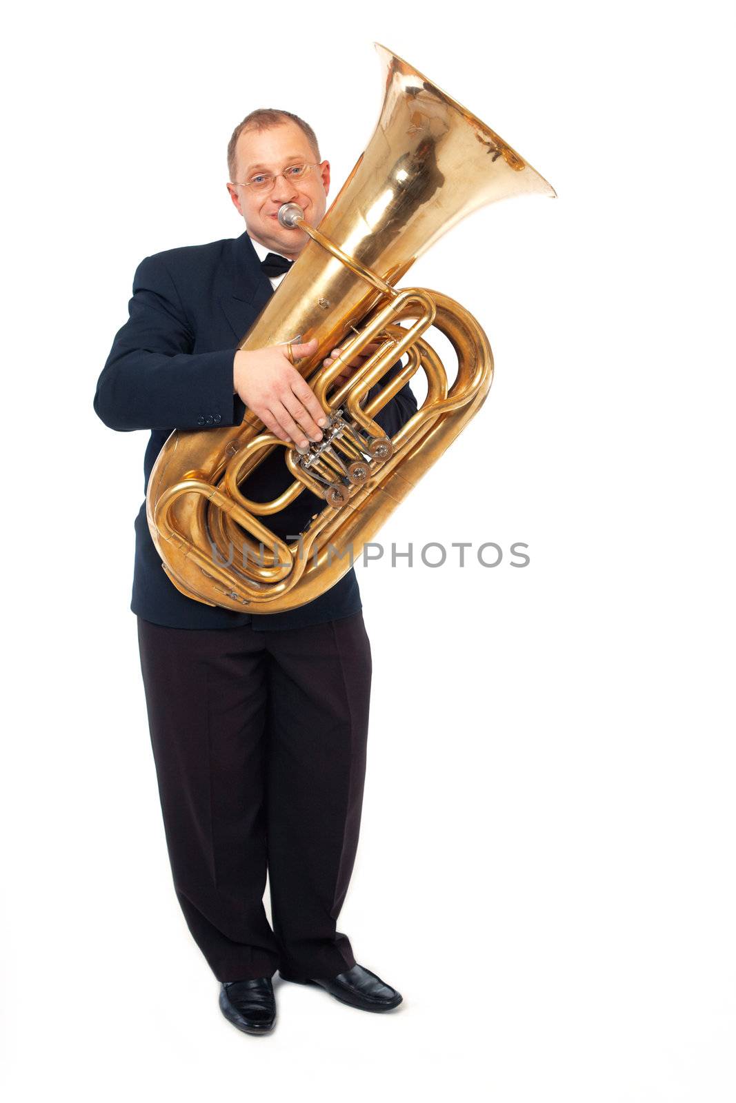 Young tubaist is playing his instrument