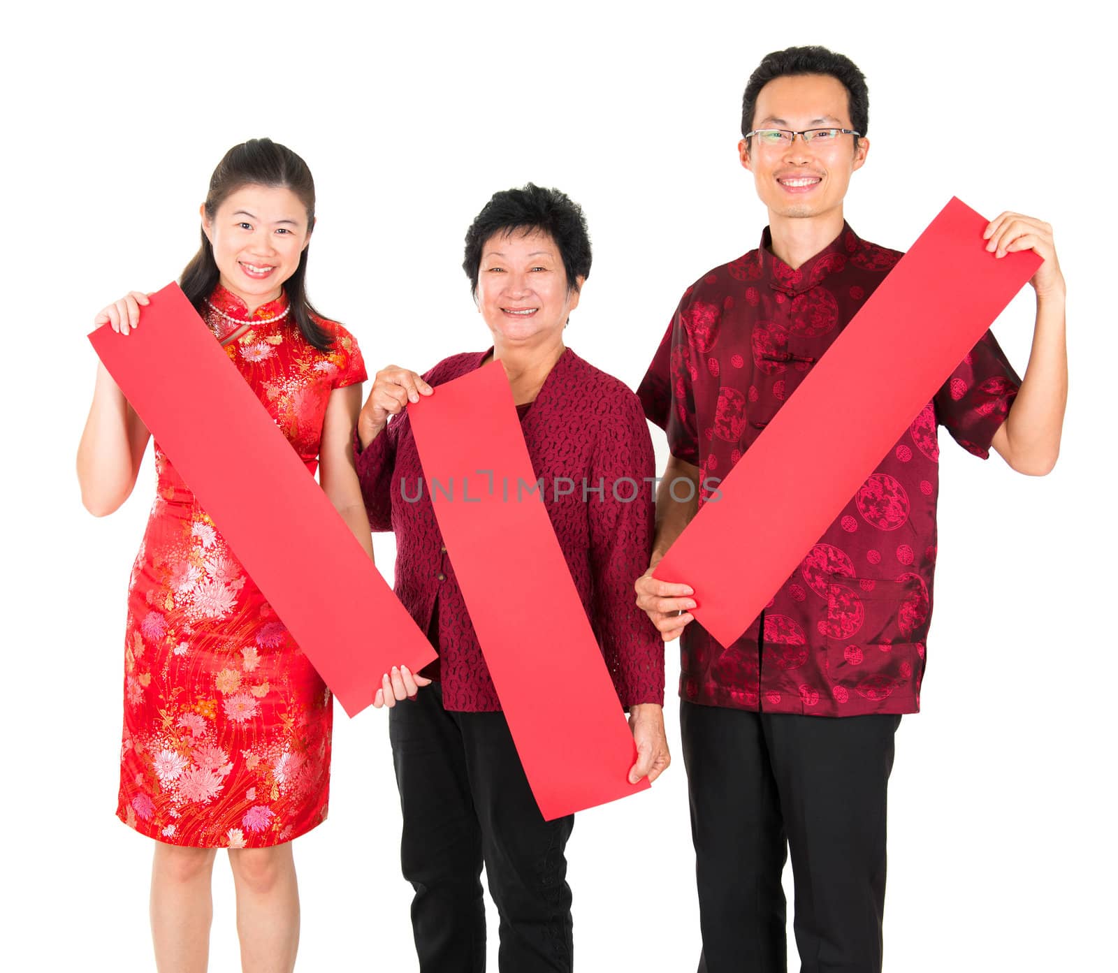 Happy chinese new year. Asian Chinese family holding red spring couplets, ready for text standing over white background