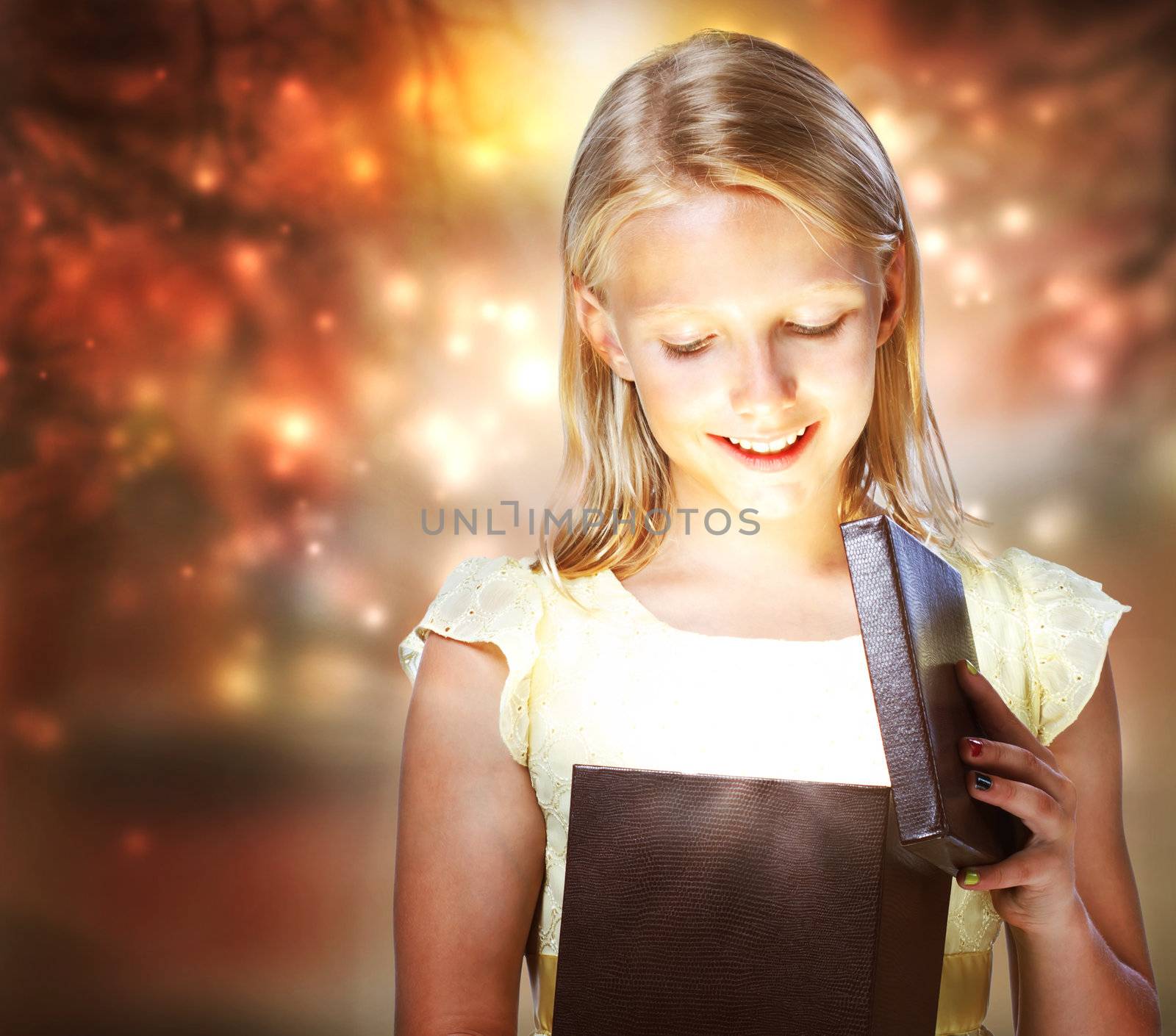 Happy Blonde Girl Opening a Present Box