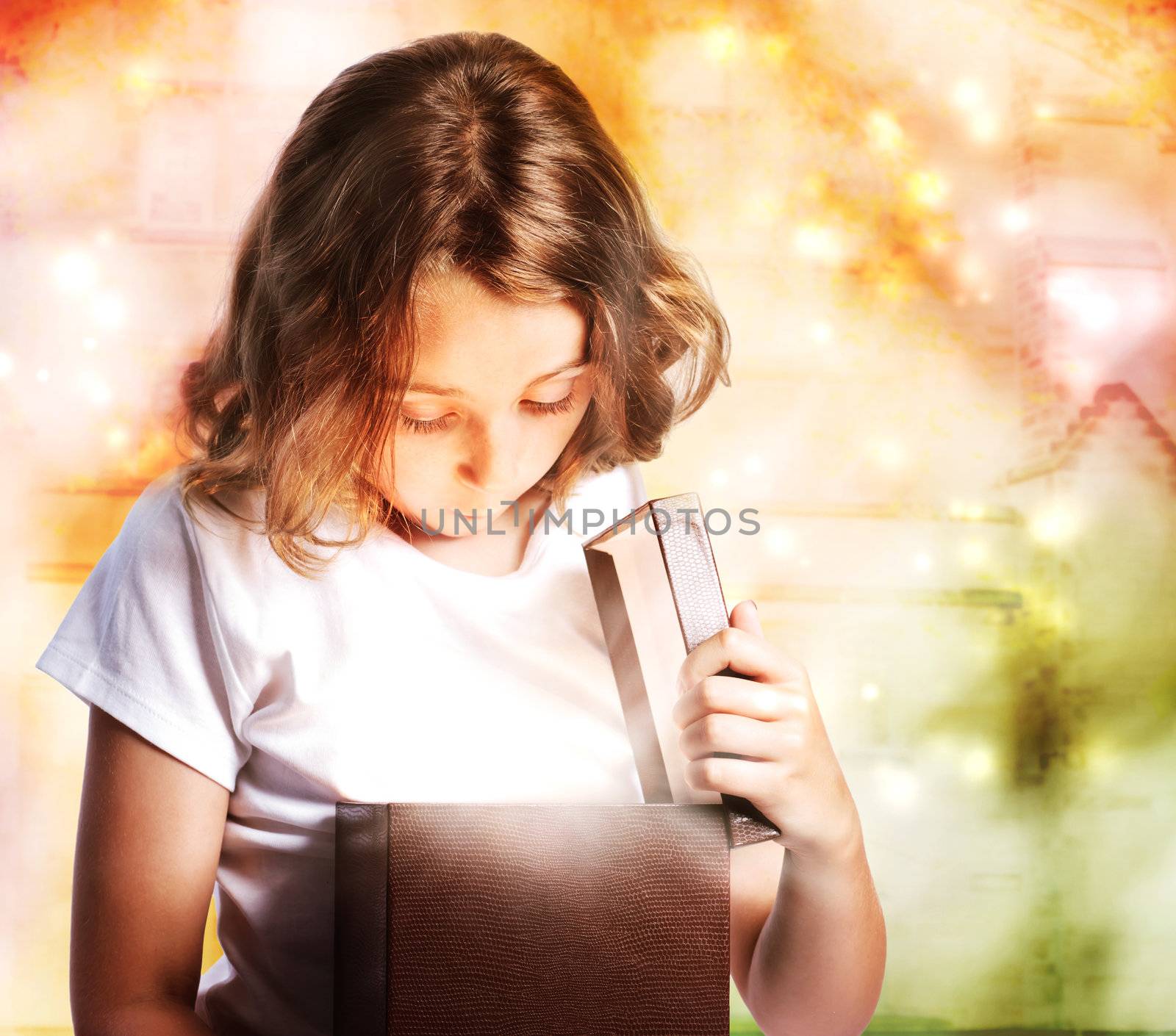 Happy Little Girl Opening a Present Box