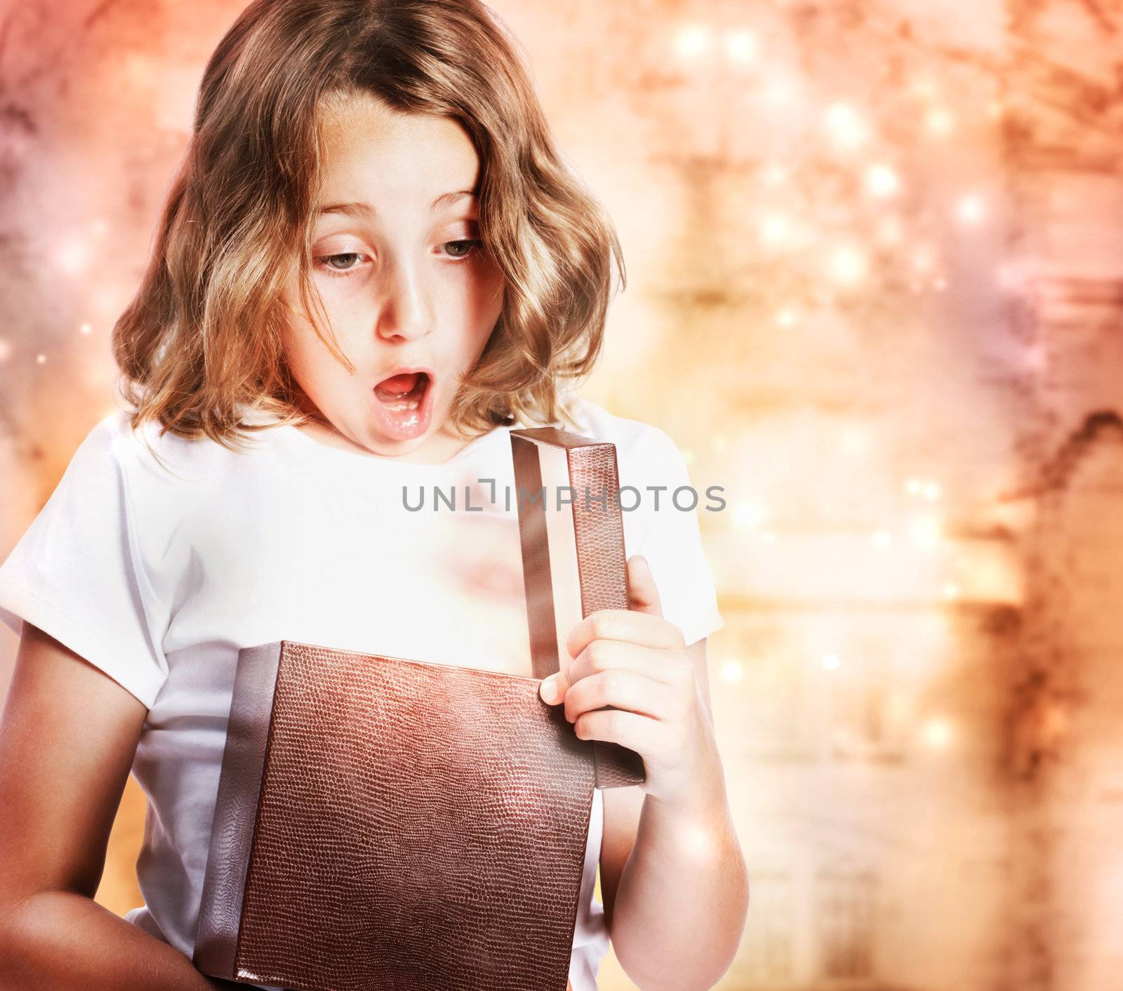 Happy Little Girl Opening a Present