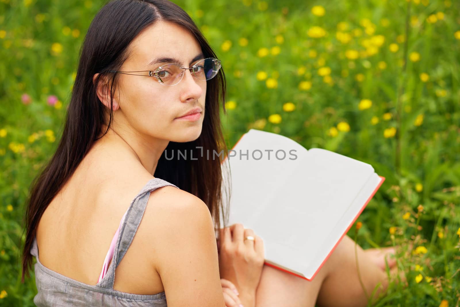  Portrait of a young  female with a book by romanshyshak