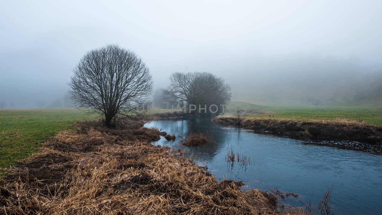 A river in norway in foggy weather