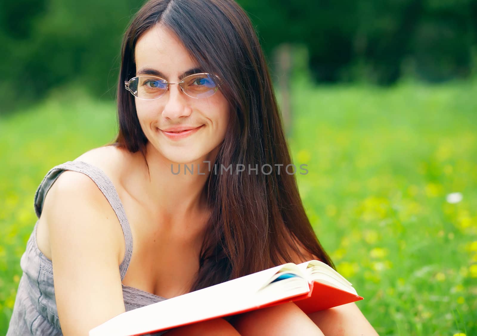  Portrait of a young  female with a book by romanshyshak