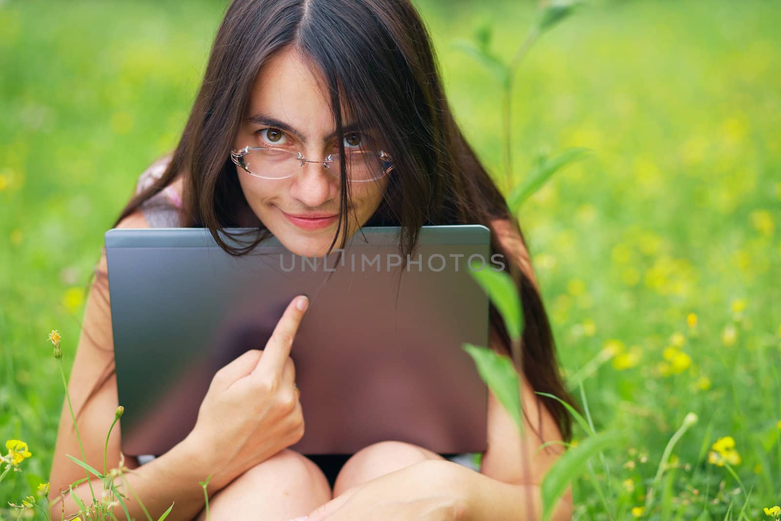 Young woman with his computer by romanshyshak