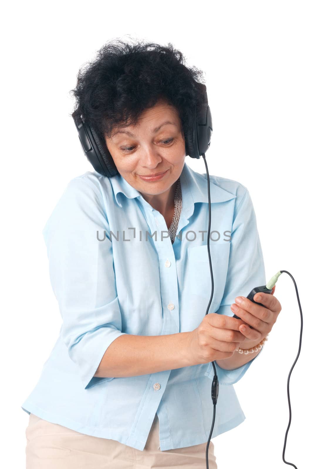 Elder happy woman with phones and mobile listening something.