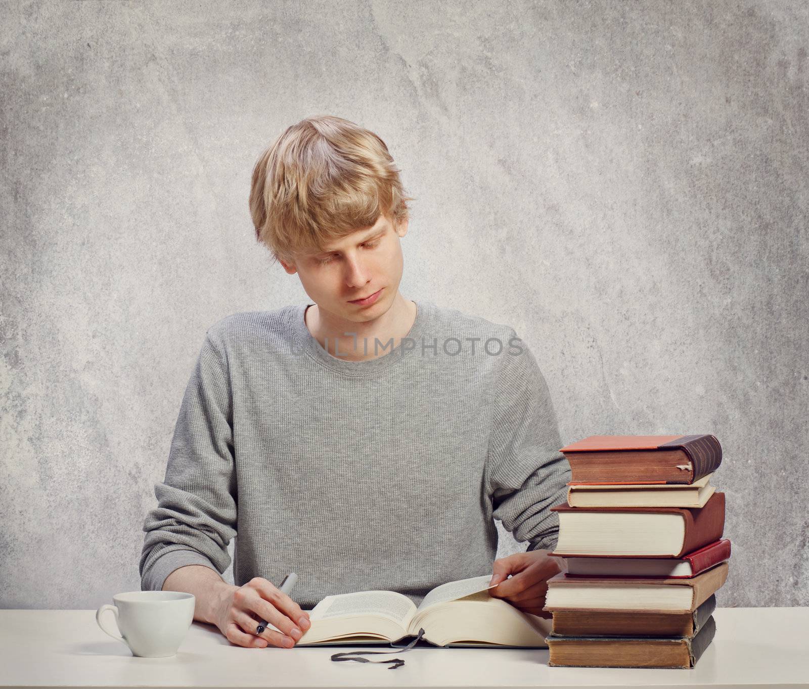 Young Male Adult Studying at Desk