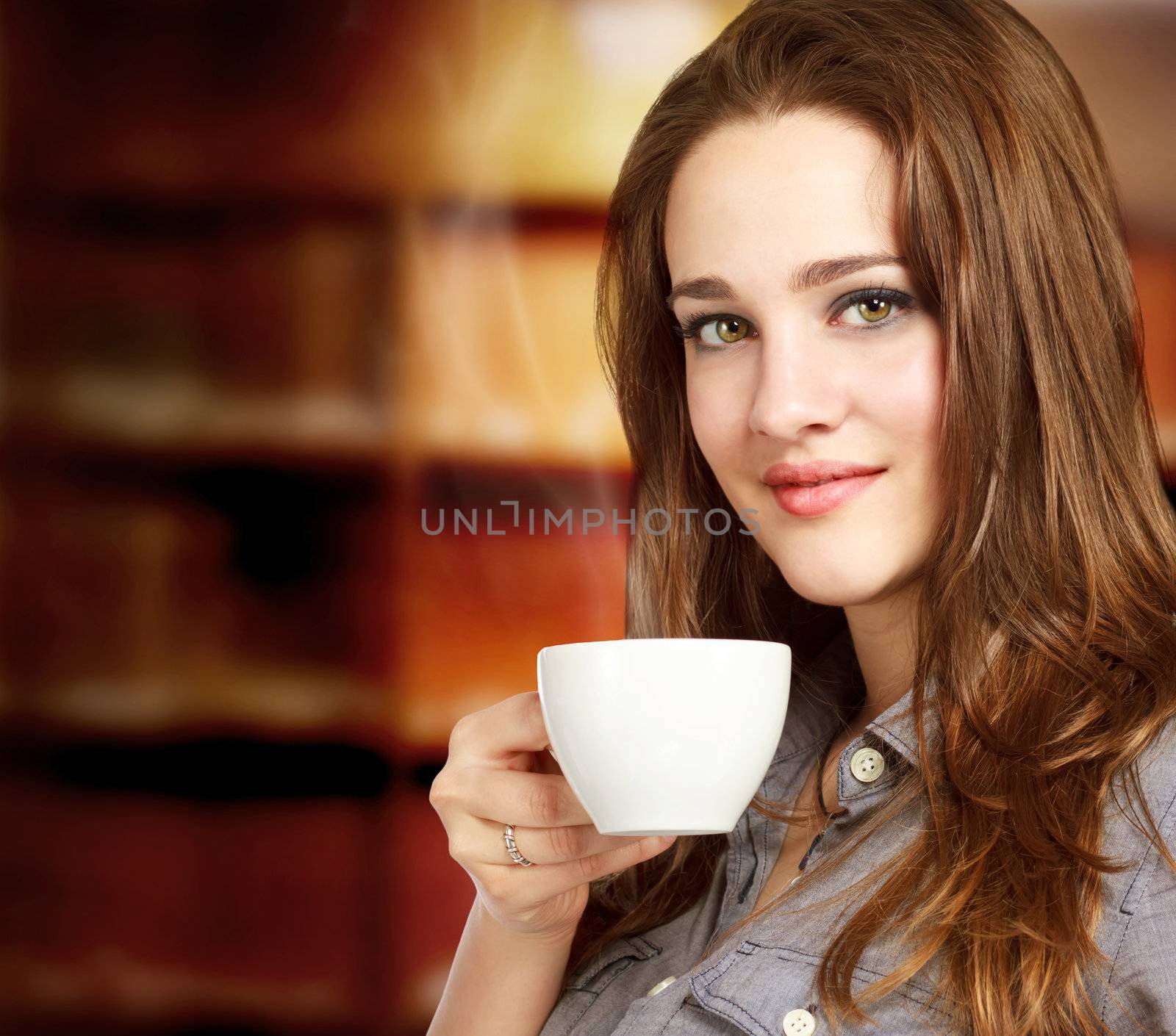 Young Woman Enjoying a Hot Beverage by melpomene