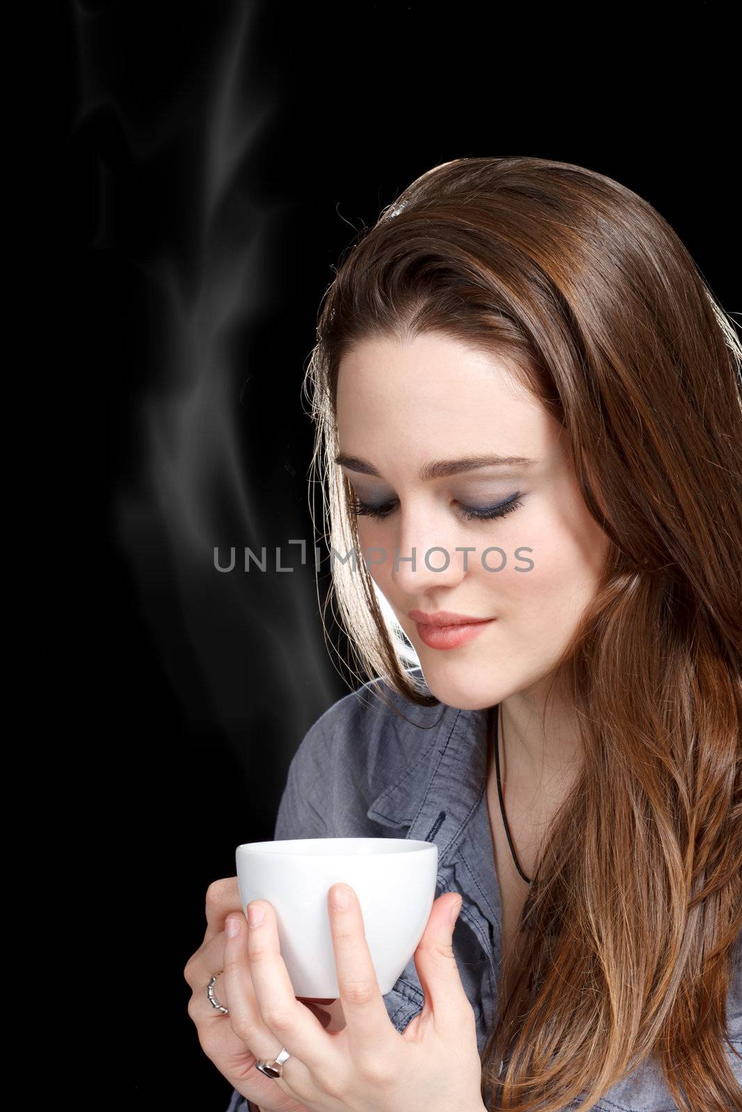 Young Woman Enjoying a Hot Beverage by melpomene