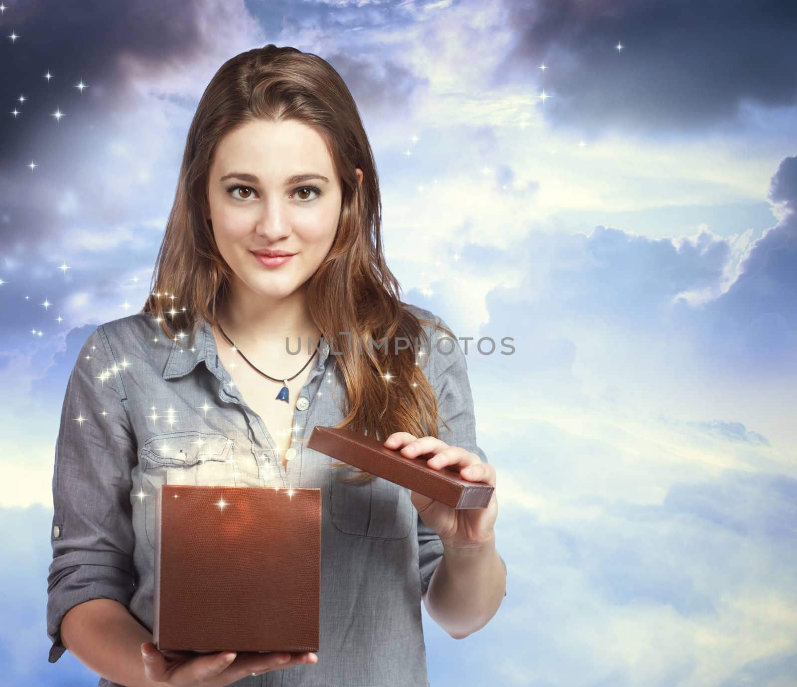 Beautiful Young Woman Opening a Gift Box