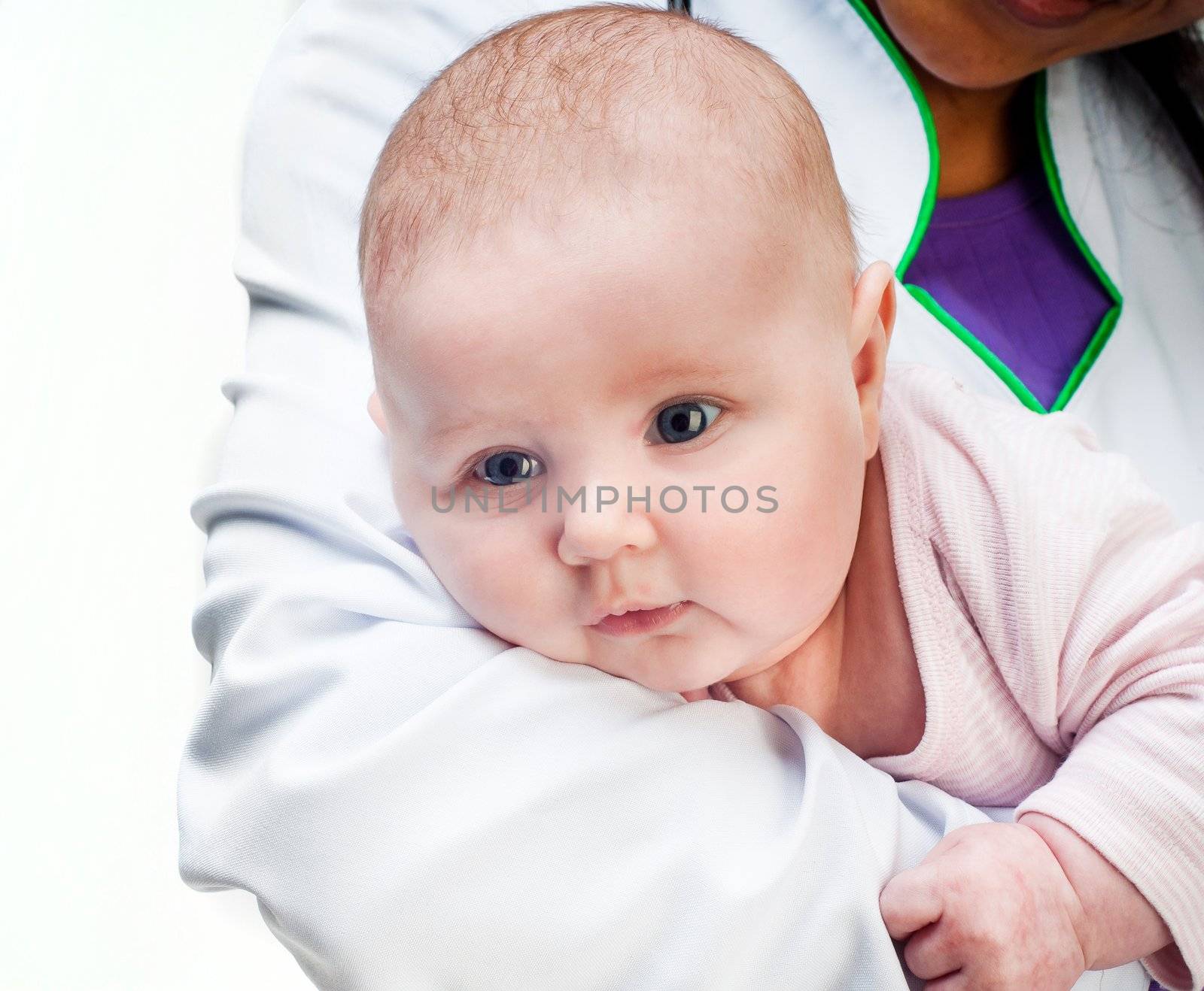 Small baby in doctors hands isolated on a white background