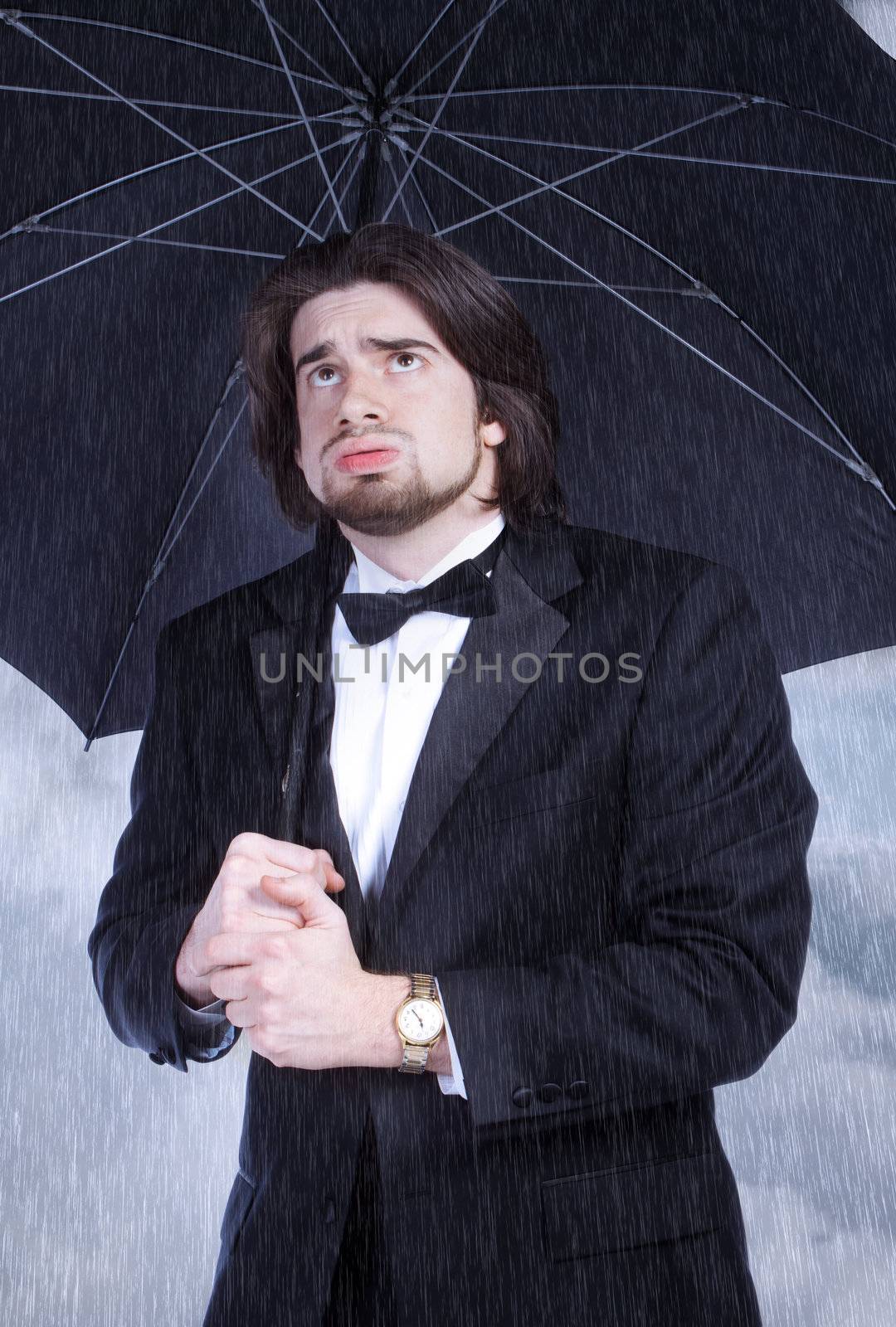 Unhappy Man in Suit Holding Umbrella in the Rain and Sighing