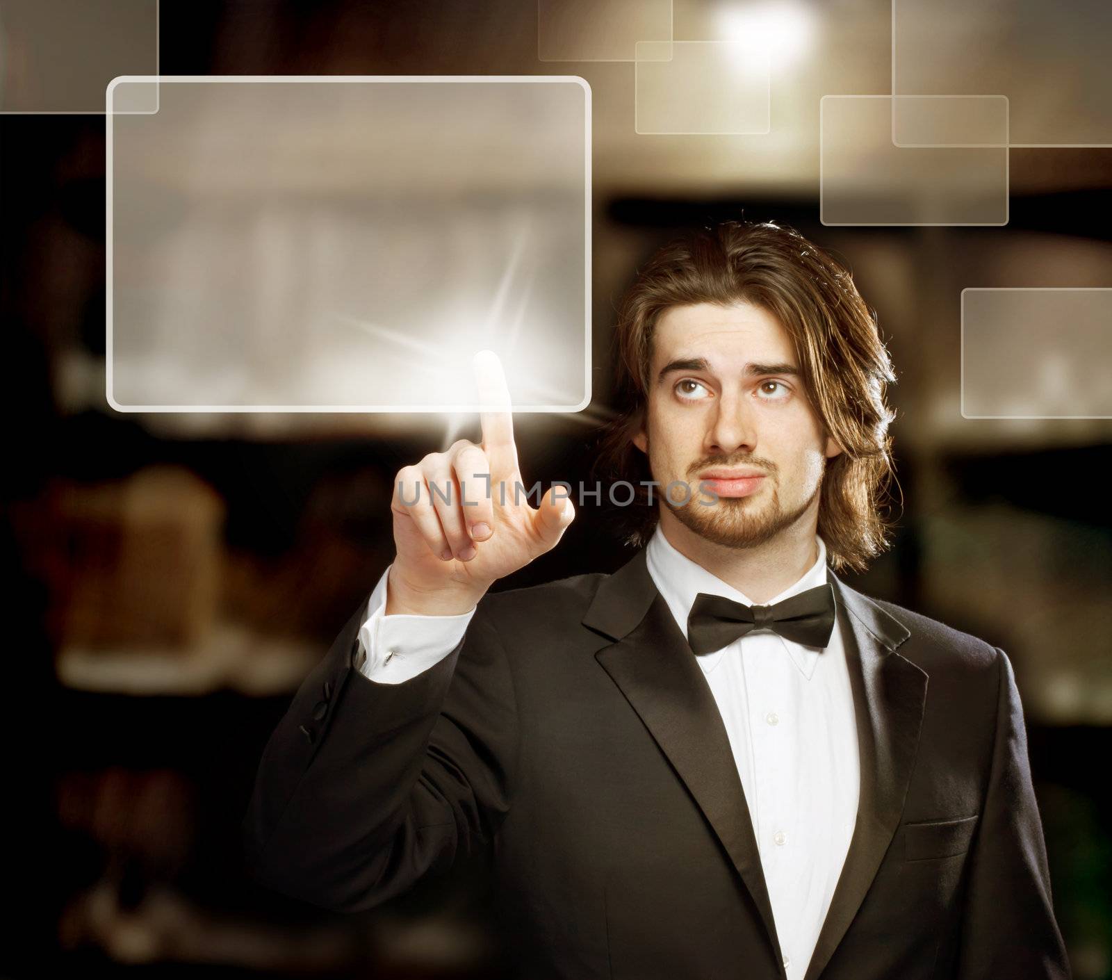 Man with Bow Tie  Looking and Pointing a Touch Screen
