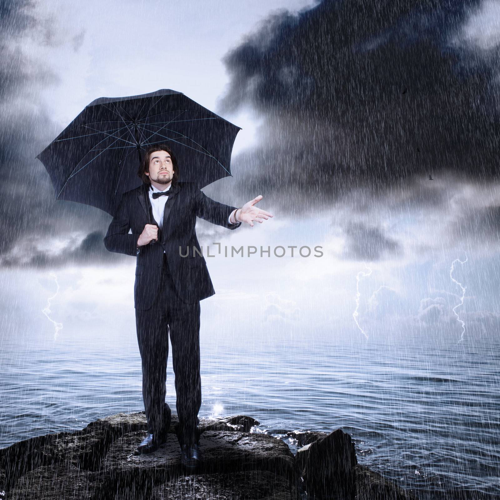 Man Under Umbrella Checking for Rain Coming or Clearing by melpomene