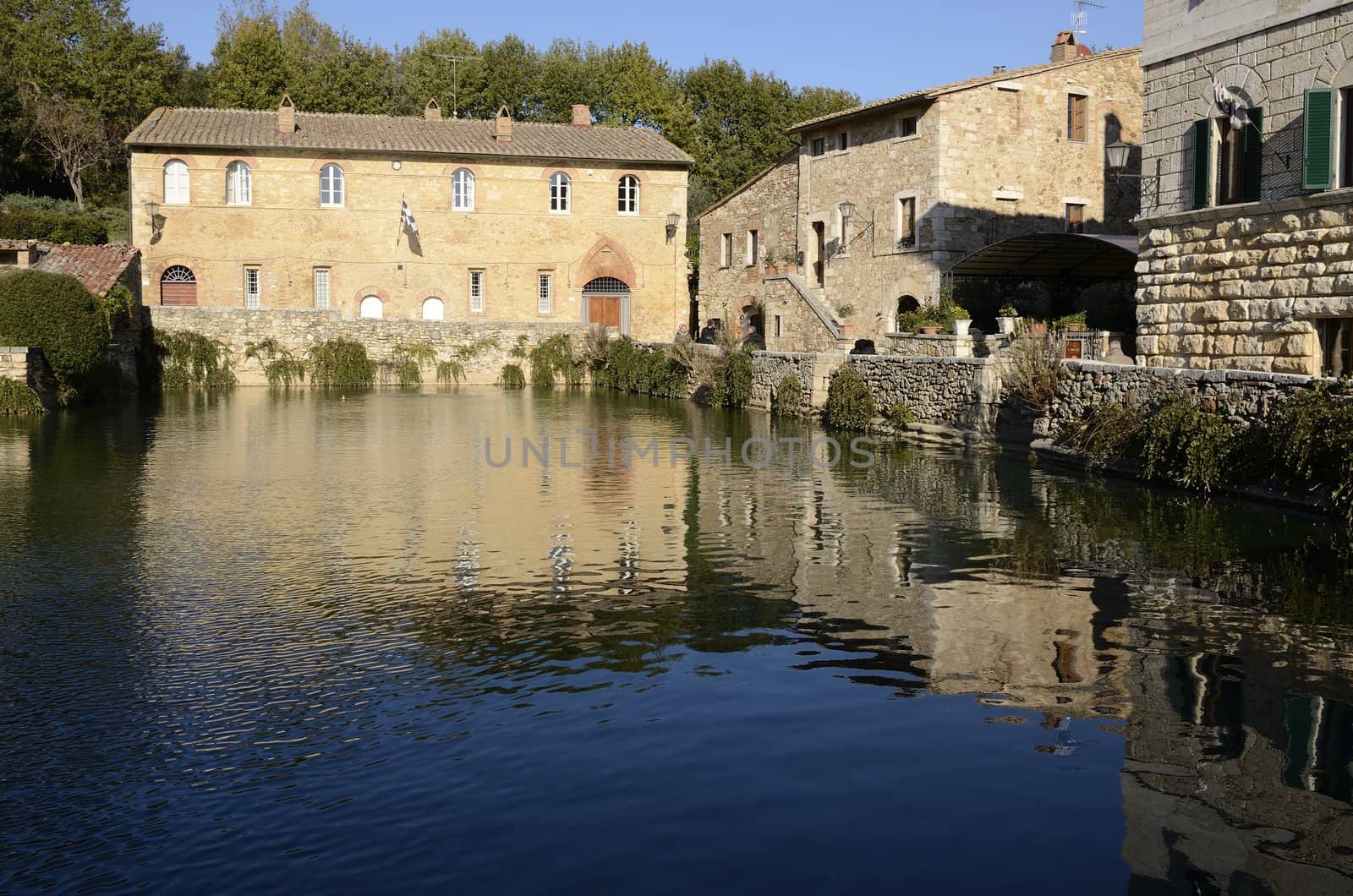 old thermal baths in the medieval village Bagno Vignoni, Tuscany, Italy - spa basin in the antique italian town