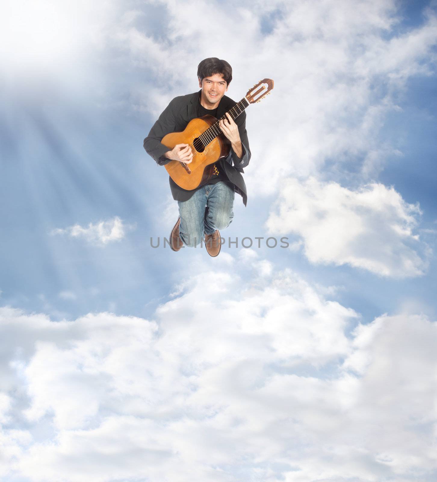 Acoustic Guitar Player Jumping in the Clouds