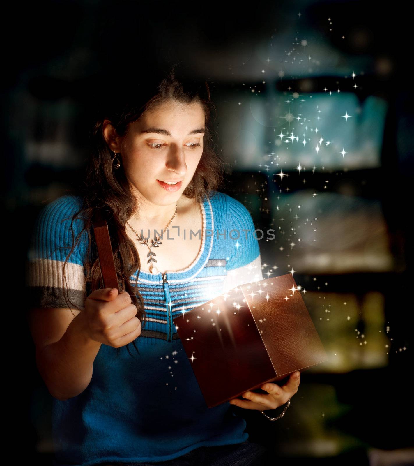 Happy Young Woman Opening a Gift Box