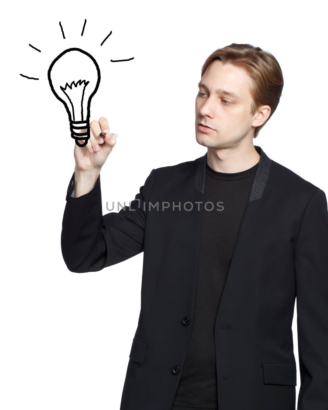 Man drawing a light bulb with black marker