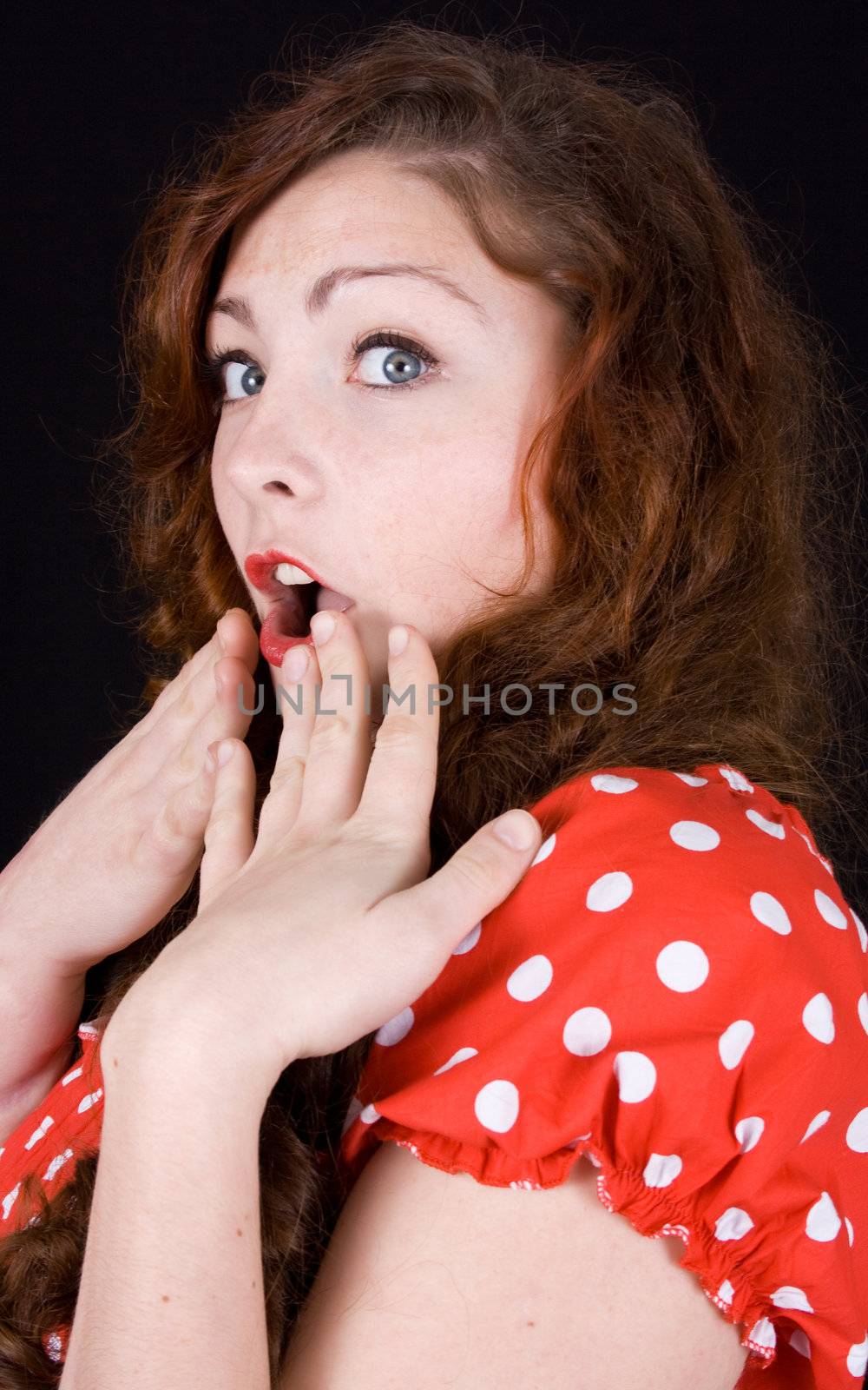 young scared, terrified woman holding hand on face isolated over white background