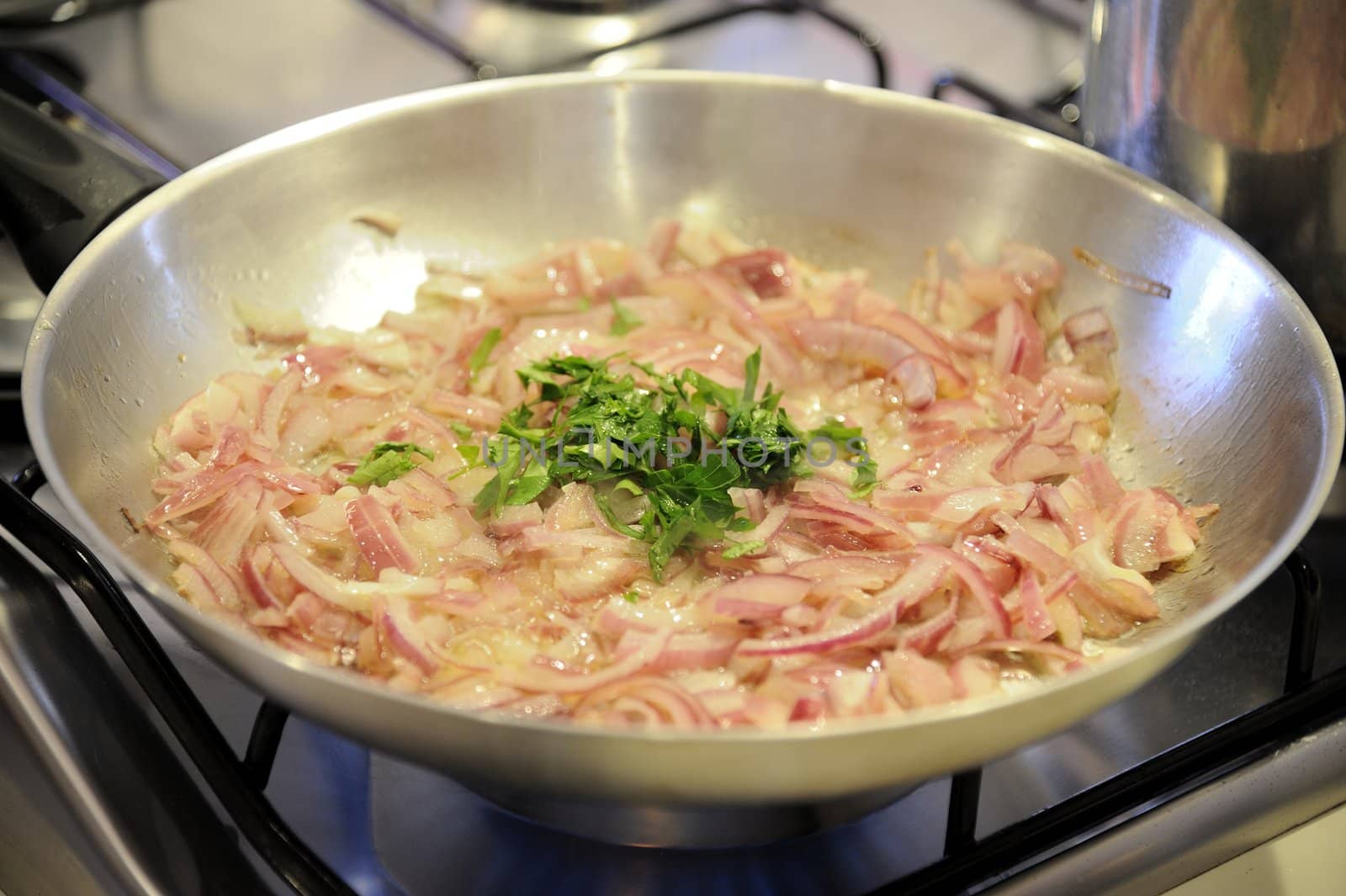 The preparation of the sauce for a french appetizer