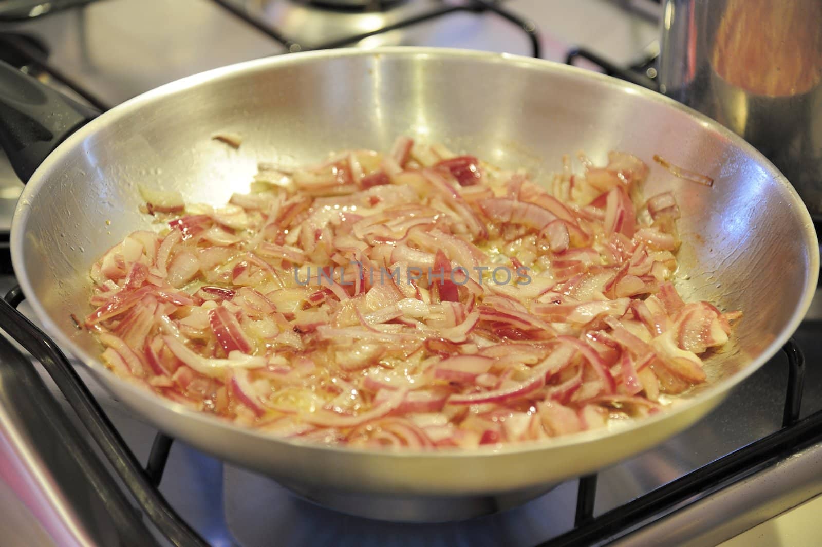 Onion fried in a pan by mizio1970