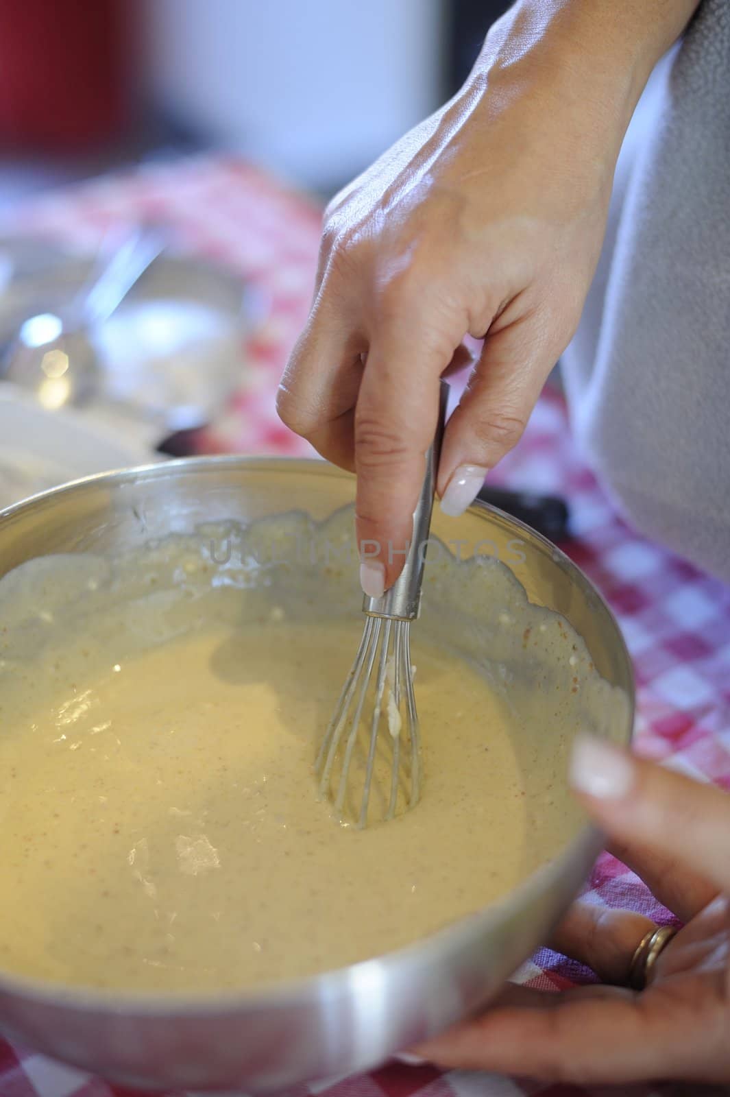 The making of a dessert topping with sugar and eggs