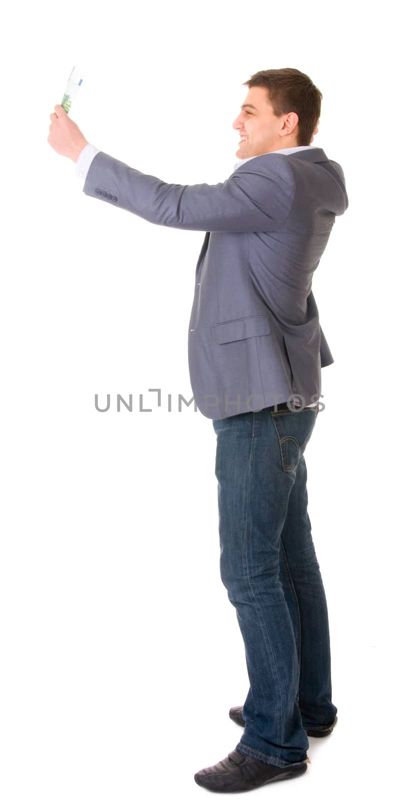 Happy young businessman holding money isolated ob white background