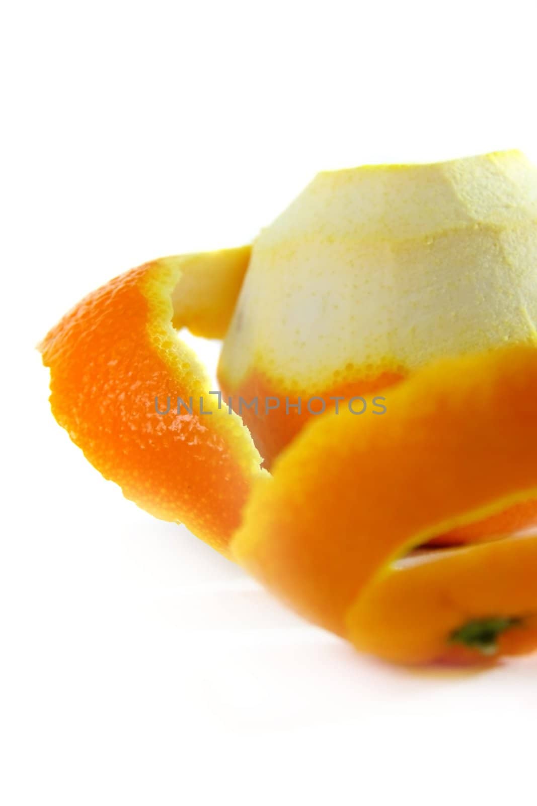 peeling one orange on white isolated background