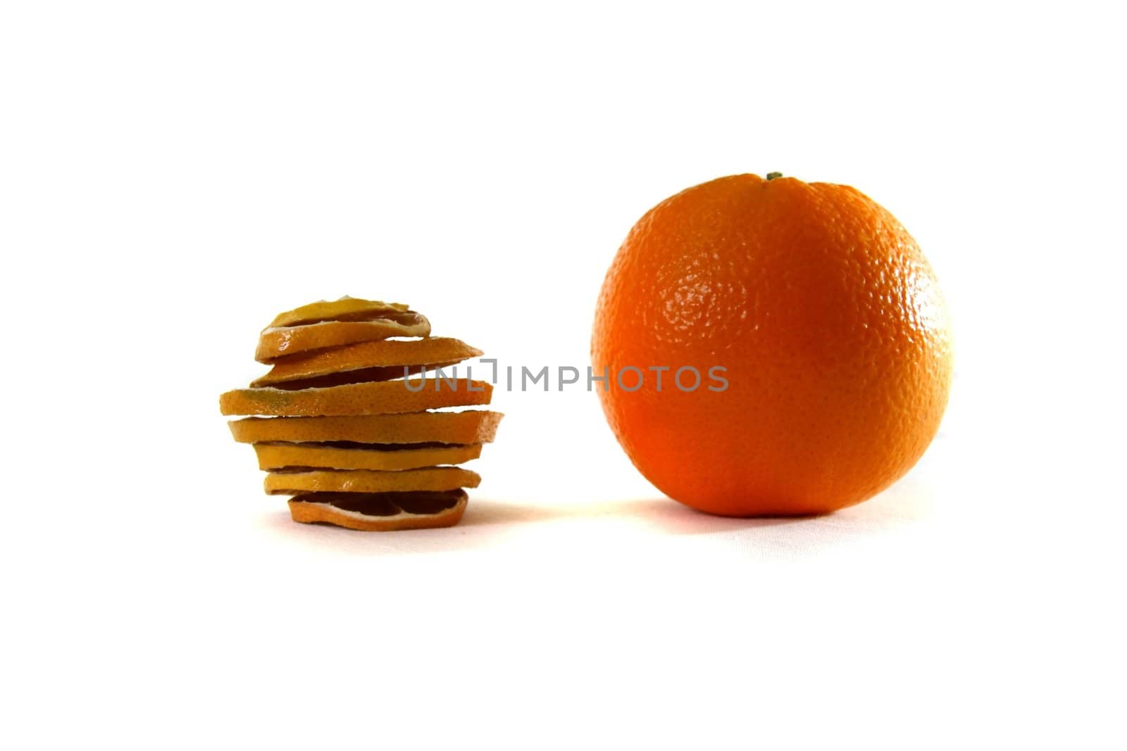 Dried sliced orange and fresh orange together on white background
